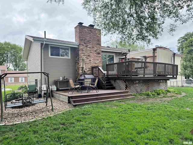 1666 Outrigger Rd, Galesburg, IL 61401 - back of house with a chimney and a wooden deck