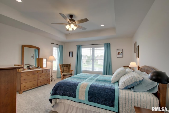 4619 Trinity Lakes Dr, Quincy, IL 62305 - bedroom with light colored carpet, a raised ceiling, recessed lighting, and ceiling fan