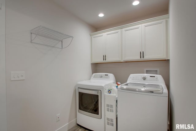 4619 Trinity Lakes Dr, Quincy, IL 62305 - laundry area with separate washer and dryer, cabinet space, recessed lighting, and baseboards