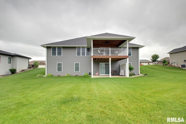 4619 Trinity Lakes Dr, Quincy, IL 62305 - rear view of property featuring a yard, a patio, central air condition unit, and roof with shingles
