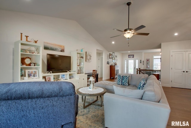 4619 Trinity Lakes Dr, Quincy, IL 62305 - living area with wood finished floors, ceiling fan, french doors, vaulted ceiling, and recessed lighting