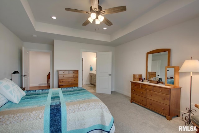 4619 Trinity Lakes Dr, Quincy, IL 62305 - bedroom with a tray ceiling, light colored carpet, baseboards, recessed lighting, and ceiling fan