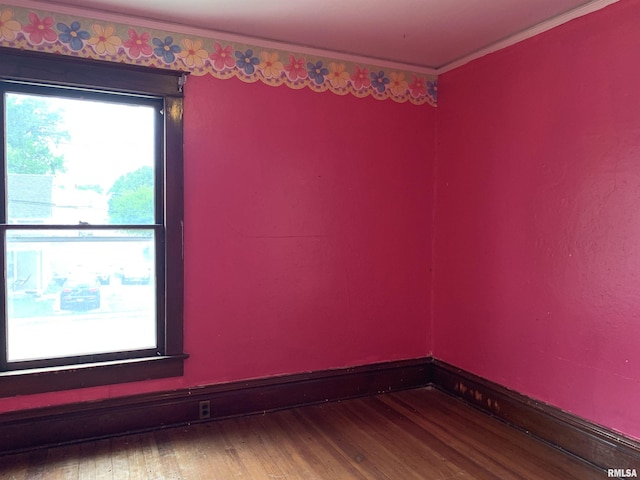 545 Bainbridge St, Barry, IL 62312 - empty room with wood finished floors and crown molding