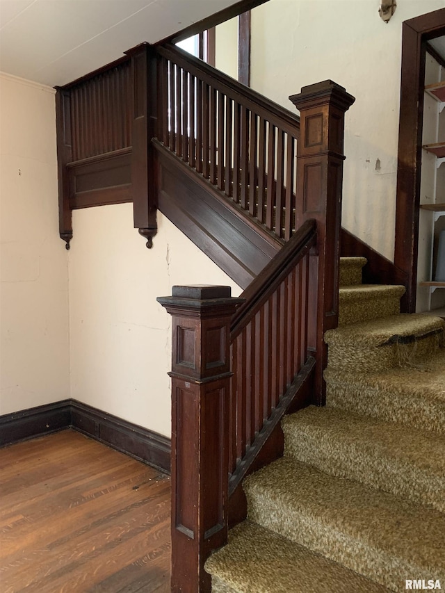545 Bainbridge St, Barry, IL 62312 - stairway featuring wood finished floors and baseboards