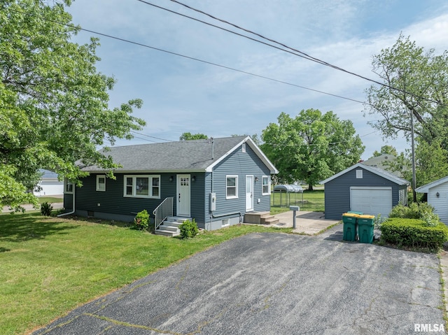 1520 W Losey St, Galesburg, IL 61401 - view of front of house featuring a detached garage, driveway, an outdoor structure, a front yard, and roof with shingles