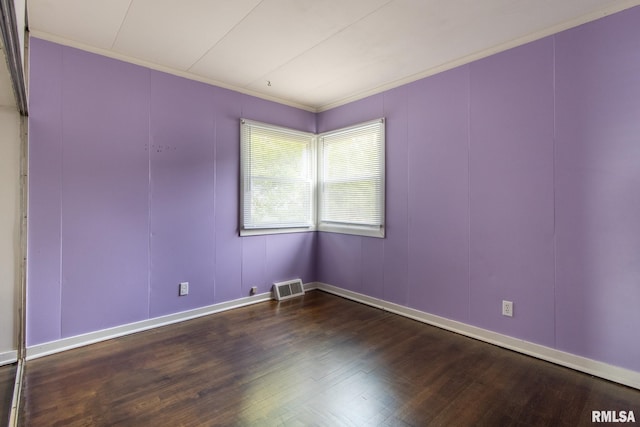 1520 W Losey St, Galesburg, IL 61401 - empty room with wood finished floors, crown molding, baseboards, and a decorative wall