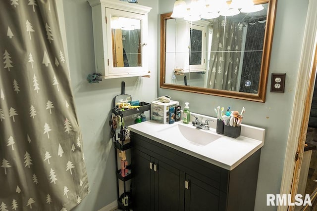 607 E 3rd St, Kinmundy, IL 62854 - bathroom featuring vanity and a shower with curtain