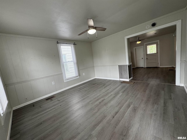 1248 N Ledlie Ave, Springfield, IL 62702 - spare room with ceiling fan, dark wood-type flooring, wainscoting, baseboards, and a decorative wall