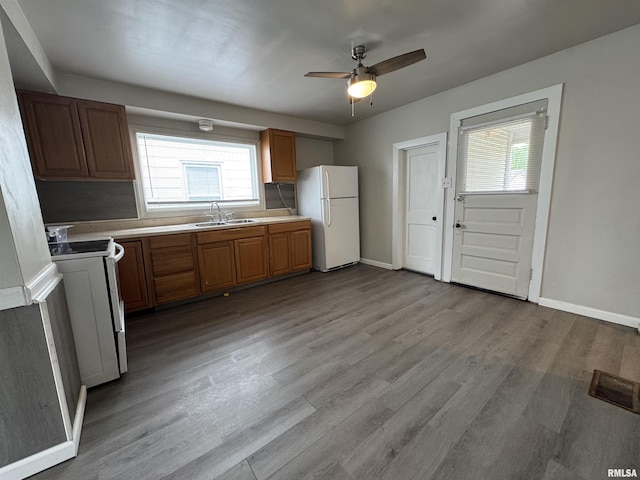 1248 N Ledlie Ave, Springfield, IL 62702 - kitchen with freestanding refrigerator, range with electric cooktop, light countertops, and plenty of natural light