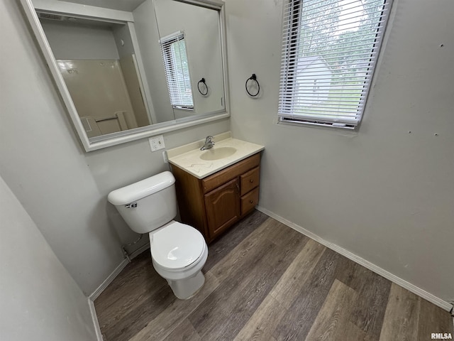 1248 N Ledlie Ave, Springfield, IL 62702 - bathroom featuring toilet, wood finished floors, vanity, and baseboards