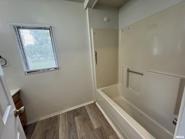 1248 N Ledlie Ave, Springfield, IL 62702 - bathroom featuring wood finished floors, vanity, baseboards, and shower / bathtub combination