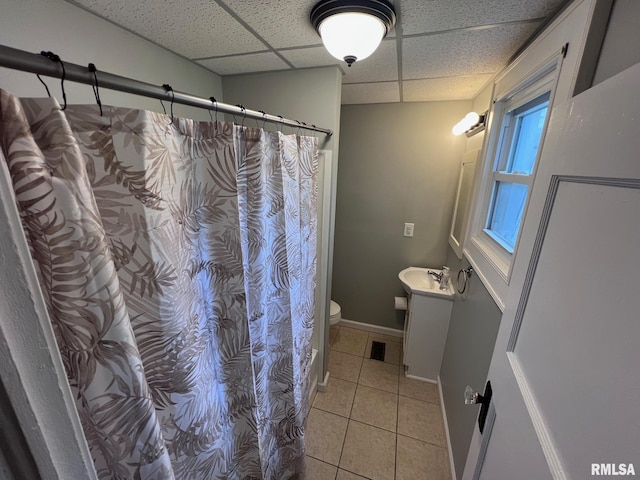 1312 N 3rd St, Springfield, IL 62702 - bathroom featuring a paneled ceiling, vanity, tile patterned flooring, toilet, and curtained shower