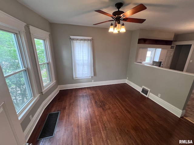 1312 N 3rd St, Springfield, IL 62702 - spare room featuring baseboards, dark wood finished floors, and a ceiling fan