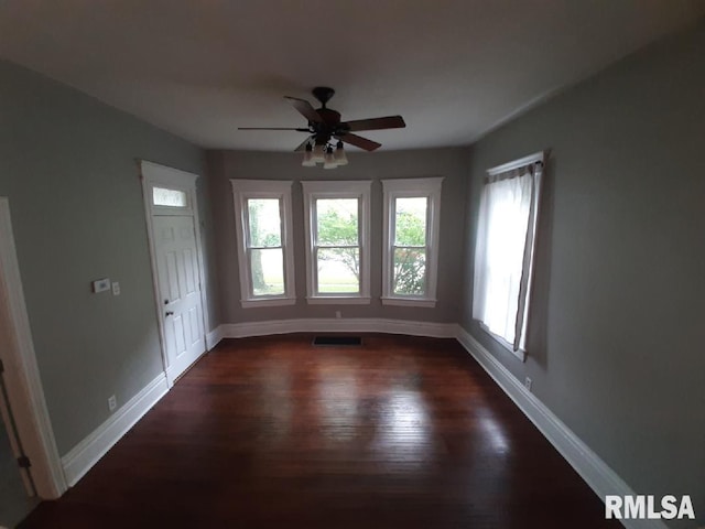 1312 N 3rd St, Springfield, IL 62702 - unfurnished room with dark wood-style flooring, baseboards, and ceiling fan