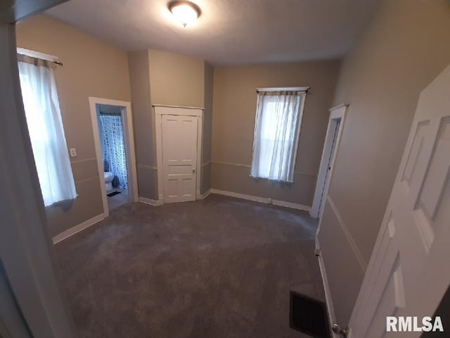 1312 N 3rd St, Springfield, IL 62702 - unfurnished bedroom with dark colored carpet and baseboards