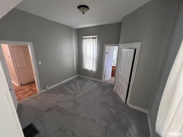 1312 N 3rd St, Springfield, IL 62702 - unfurnished bedroom with carpet flooring and baseboards