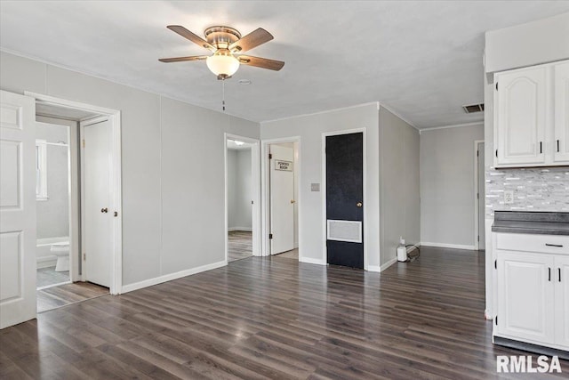 8 Melody Ln, Springfield, IL 62702 - unfurnished living room with ceiling fan, dark wood-type flooring, crown molding, and baseboards