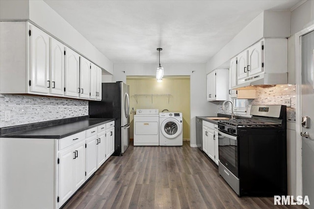 8 Melody Ln, Springfield, IL 62702 - kitchen featuring separate washer and dryer, appliances with stainless steel finishes, dark countertops, under cabinet range hood, and white cabinets