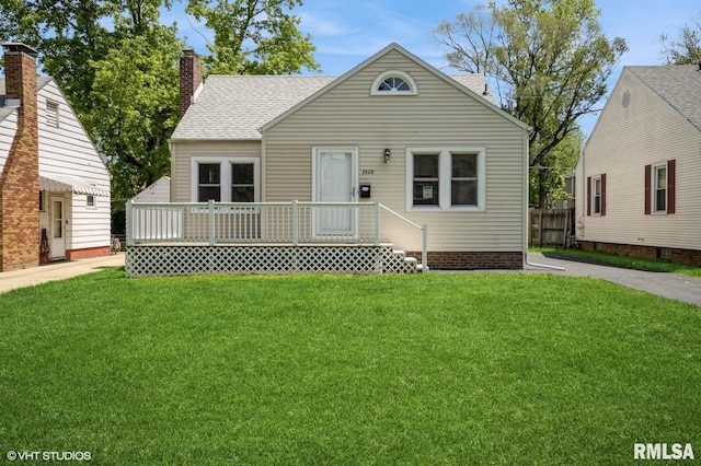 2428 S 8th St, Springfield, IL 62703 - bungalow-style home with a front lawn, a chimney, roof with shingles, and a deck