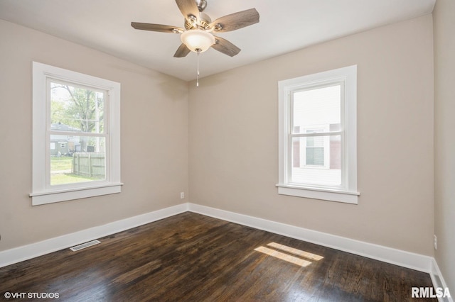 2428 S 8th St, Springfield, IL 62703 - unfurnished room featuring dark wood-type flooring, baseboards, and ceiling fan