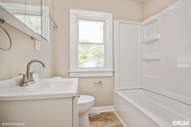 2428 S 8th St, Springfield, IL 62703 - bathroom featuring baseboards, vanity, toilet, and shower / washtub combination