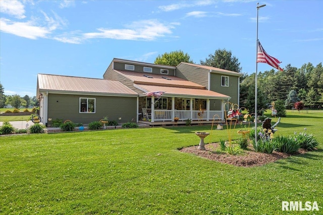 4101 N 8th St, Springfield, IL 62707 - rear view of house featuring a lawn, a porch, and metal roof