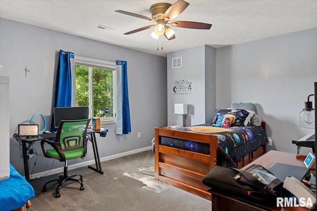4101 N 8th St, Springfield, IL 62707 - carpeted bedroom with baseboards, ceiling fan, and a textured ceiling