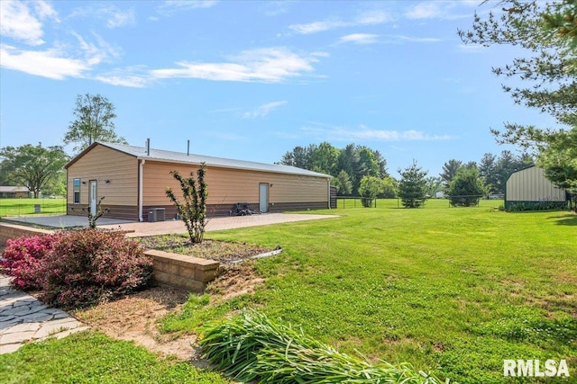4101 N 8th St, Springfield, IL 62707 - view of grassy yard with a patio and an outbuilding