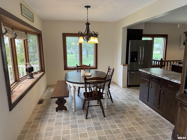 18382 N Quiver Beach Rd, Havana, IL 62644 - dining space featuring a chandelier