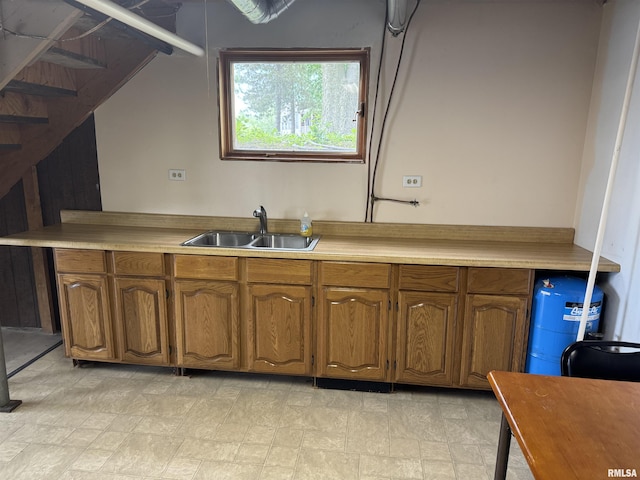 18382 N Quiver Beach Rd, Havana, IL 62644 - kitchen with a sink, brown cabinets, and light countertops