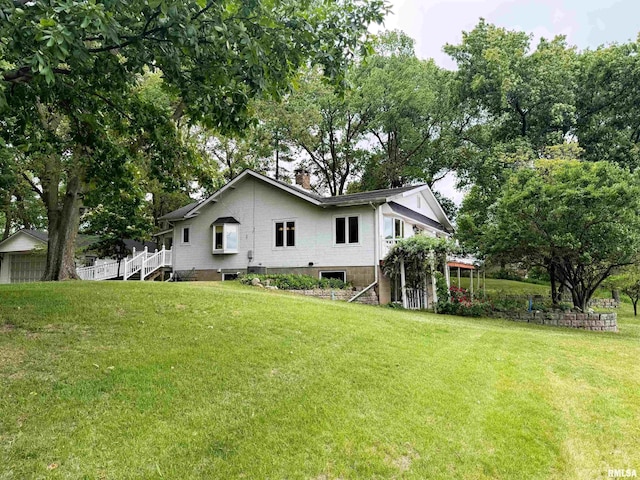 18382 N Quiver Beach Rd, Havana, IL 62644 - back of property featuring a lawn and a chimney