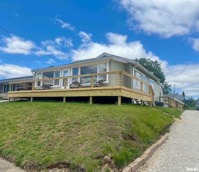 1106 S 19th St, Quincy, IL 62301 - back of house featuring a wooden deck, a lawn, and central AC unit