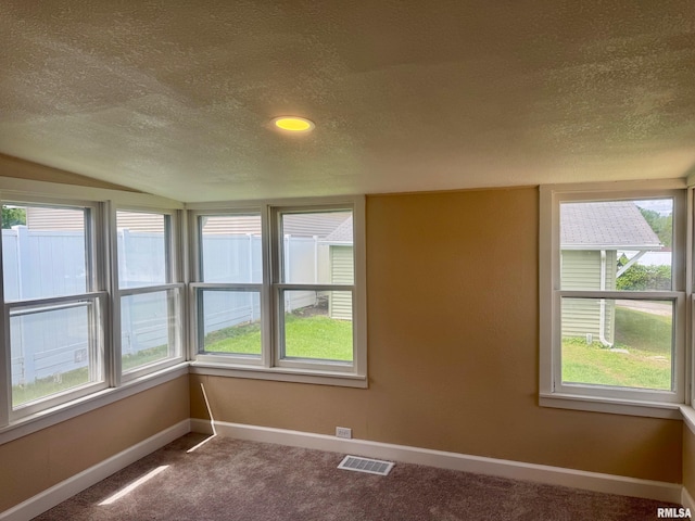 1106 S 19th St, Quincy, IL 62301 - carpeted spare room with a textured ceiling and baseboards