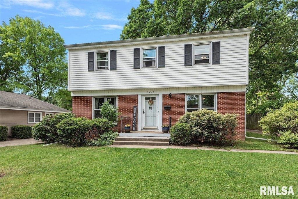2024 Cambridge Rd, Springfield, IL 62704 - colonial home with a front lawn and brick siding