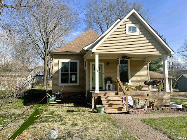 118 W Clark St, Havana, IL 62644 - bungalow-style house featuring covered porch, a ceiling fan, and roof with shingles
