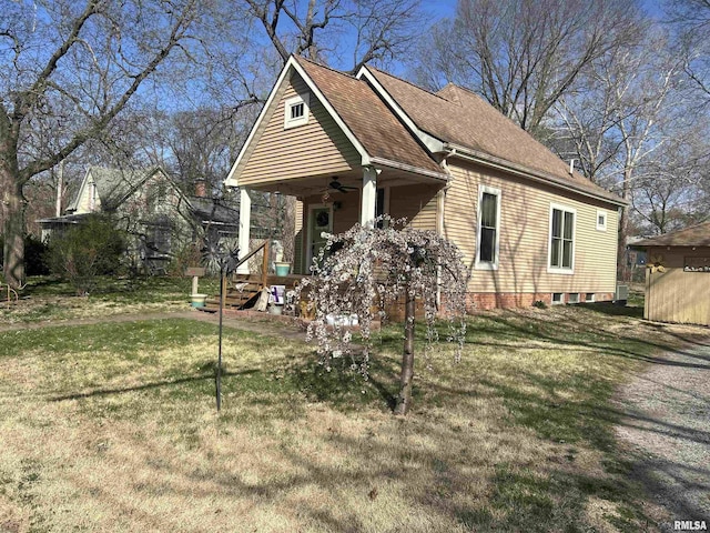 118 W Clark St, Havana, IL 62644 - view of front facade with a ceiling fan, a front lawn, a porch, and roof with shingles
