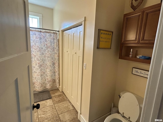 118 W Clark St, Havana, IL 62644 - bathroom with toilet, tile patterned flooring, and a shower with shower curtain