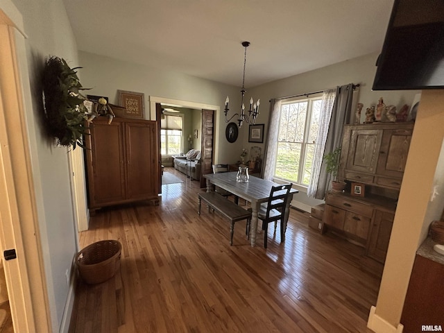 118 W Clark St, Havana, IL 62644 - dining room with light wood finished floors and a chandelier