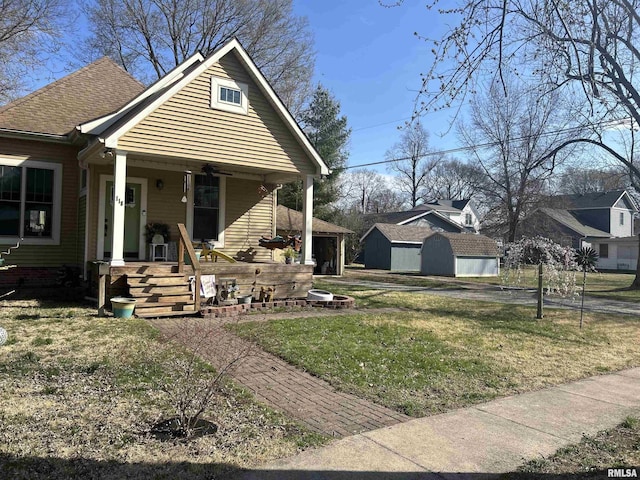 118 W Clark St, Havana, IL 62644 - view of front of home with covered porch, a front lawn, and roof with shingles