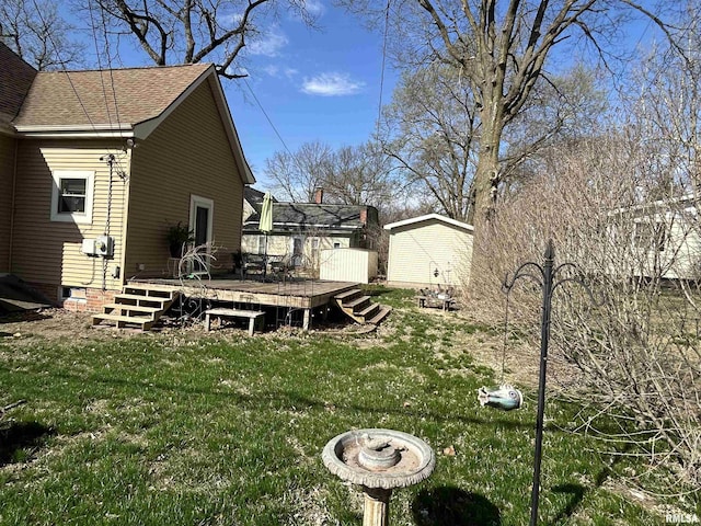 118 W Clark St, Havana, IL 62644 - view of grassy yard featuring a deck