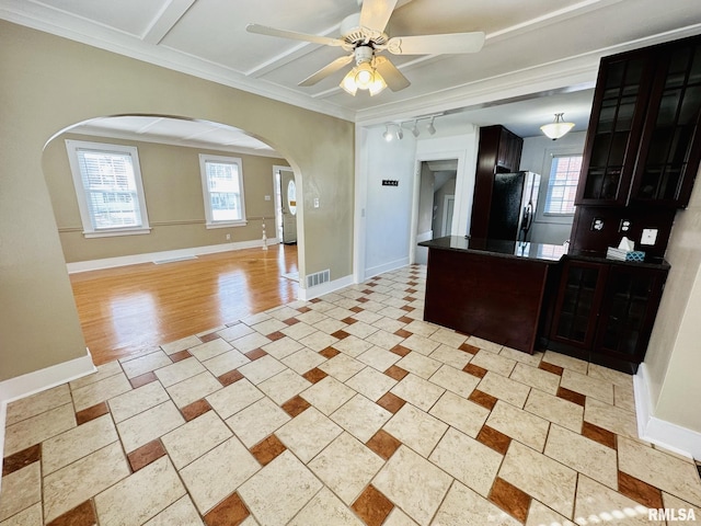 1595 N Kellogg St, Galesburg, IL 61401 - kitchen featuring arched walkways, refrigerator, ceiling fan, a peninsula, and dark countertops