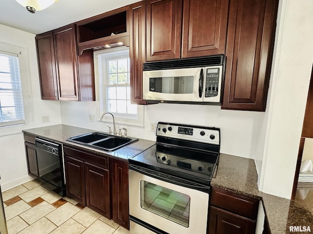 1595 N Kellogg St, Galesburg, IL 61401 - kitchen featuring appliances with stainless steel finishes, a sink, baseboards, and dark brown cabinetry