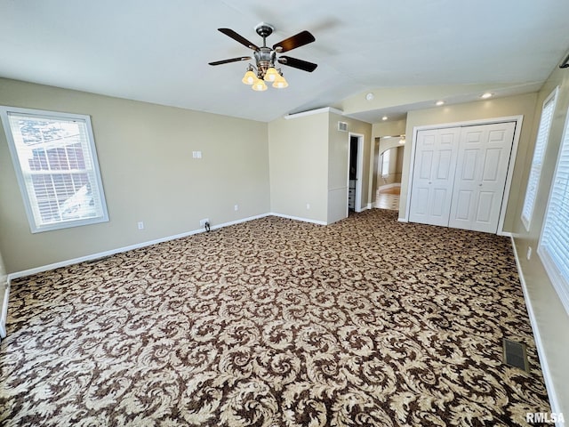 1595 N Kellogg St, Galesburg, IL 61401 - unfurnished bedroom with carpet, lofted ceiling, baseboards, ceiling fan, and a closet