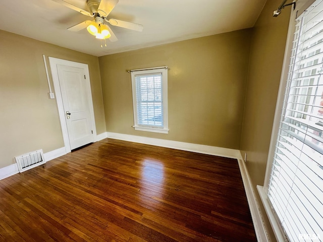 1595 N Kellogg St, Galesburg, IL 61401 - spare room featuring wood finished floors, baseboards, and a ceiling fan