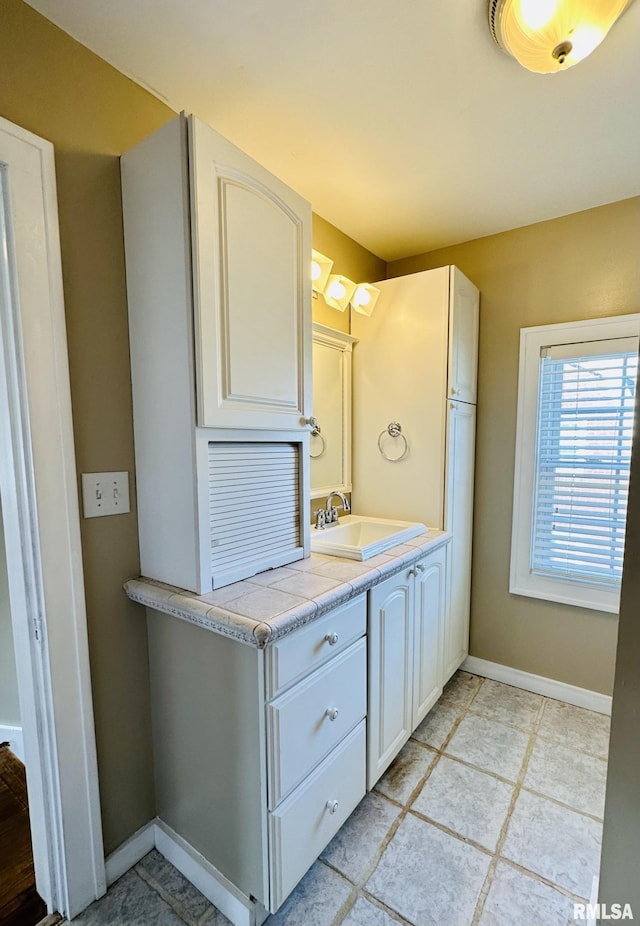 1595 N Kellogg St, Galesburg, IL 61401 - bathroom featuring vanity and baseboards