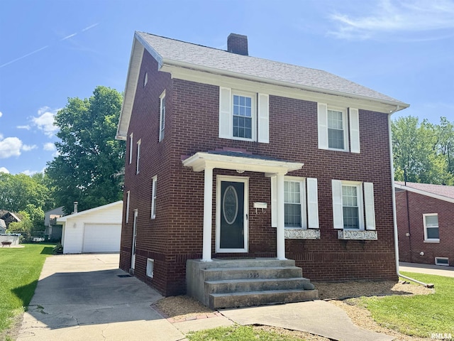 1595 N Kellogg St, Galesburg, IL 61401 - view of front of property with brick siding, a chimney, and an outdoor structure