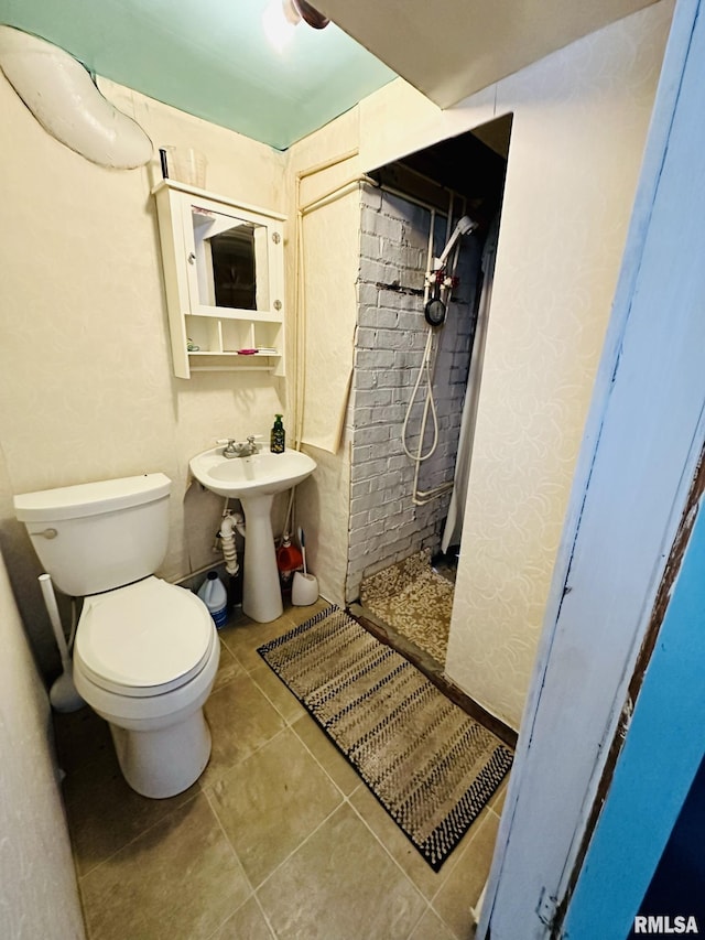 1595 N Kellogg St, Galesburg, IL 61401 - full bathroom featuring a stall shower, toilet, tile patterned flooring, and a sink