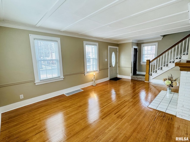 1595 N Kellogg St, Galesburg, IL 61401 - foyer featuring ornamental molding, wood finished floors, stairway, and baseboards