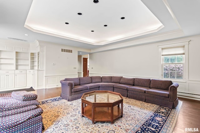 1044 Williams Blvd, Springfield, IL 62704 - living room with a raised ceiling, wood finished floors, a decorative wall, a wainscoted wall, and a baseboard radiator