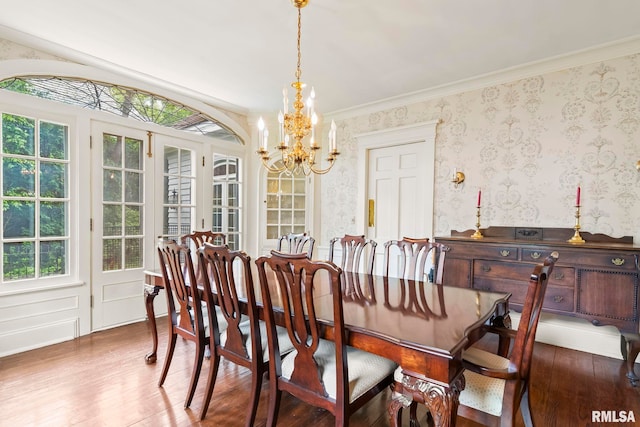 1044 Williams Blvd, Springfield, IL 62704 - dining room featuring a chandelier, wood finished floors, wallpapered walls, and ornamental molding